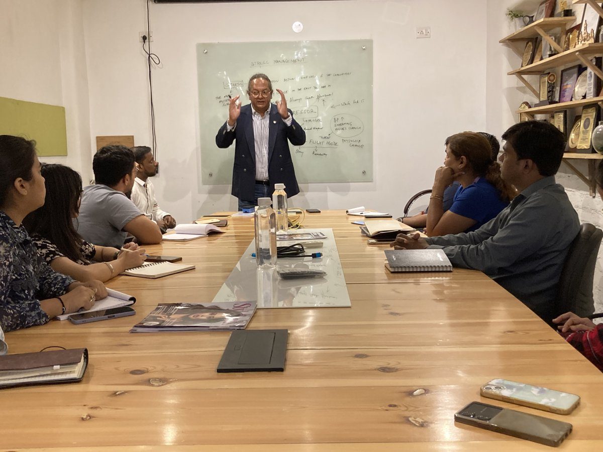Devrat Pagay leading a session at a whiteboard
